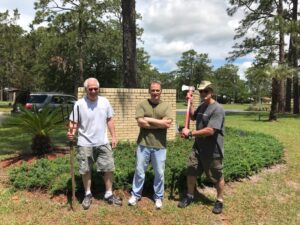 Pat Geer, Richard Geer and Jeff Strickland hamming it up at the chapel cleanup day